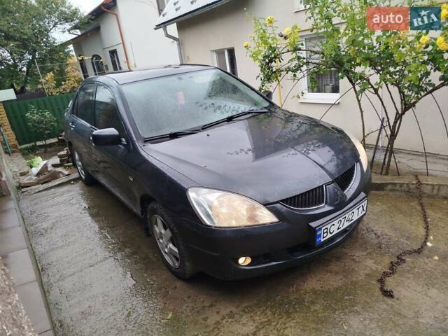 Серый Мицубиси Лансер, объемом двигателя 1.6 л и пробегом 260 тыс. км за 2750 $, фото 1 на Automoto.ua