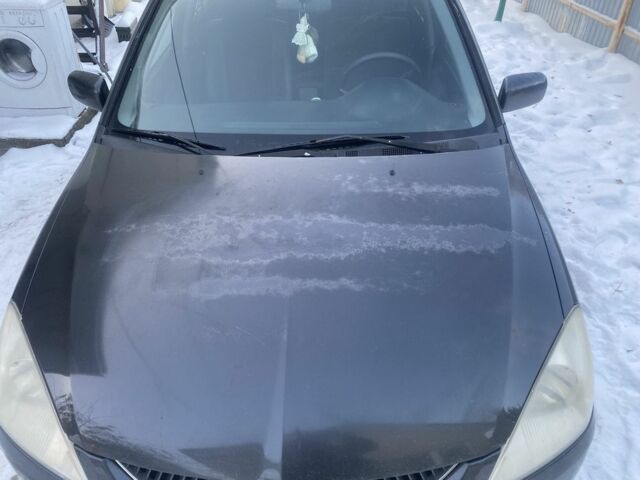 Серый Мицубиси Лансер, объемом двигателя 1 л и пробегом 330 тыс. км за 2913 $, фото 1 на Automoto.ua