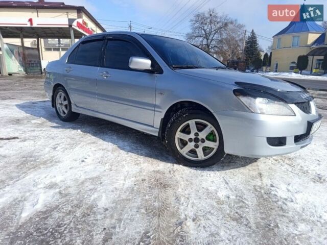 Сірий Міцубісі Lancer, об'ємом двигуна 1.58 л та пробігом 240 тис. км за 3800 $, фото 1 на Automoto.ua