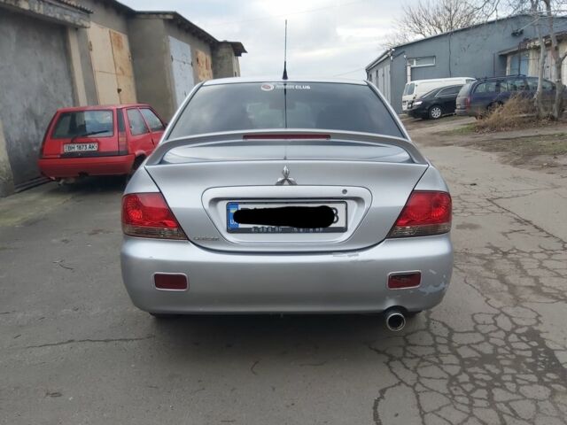 Серый Мицубиси Лансер, объемом двигателя 1.6 л и пробегом 260 тыс. км за 3200 $, фото 1 на Automoto.ua