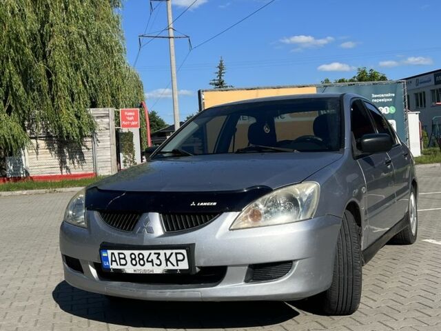 Серый Мицубиси Лансер, объемом двигателя 1.6 л и пробегом 280 тыс. км за 2700 $, фото 1 на Automoto.ua