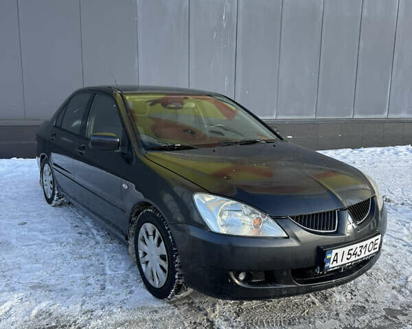 Сірий Міцубісі Lancer, об'ємом двигуна 1.58 л та пробігом 345 тис. км за 3300 $, фото 1 на Automoto.ua