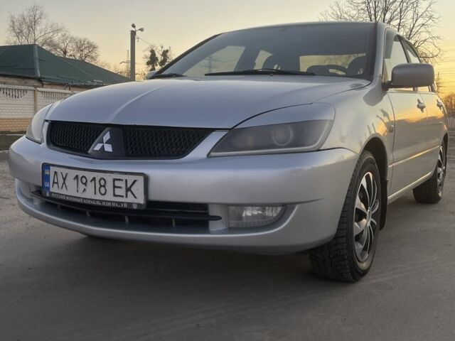 Серый Мицубиси Лансер, объемом двигателя 1.6 л и пробегом 330 тыс. км за 4500 $, фото 1 на Automoto.ua