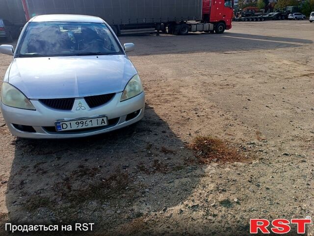 Сірий Міцубісі Lancer, об'ємом двигуна 1.6 л та пробігом 318 тис. км за 3000 $, фото 1 на Automoto.ua