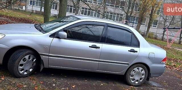 Сірий Міцубісі Lancer, об'ємом двигуна 1.6 л та пробігом 213 тис. км за 4400 $, фото 1 на Automoto.ua