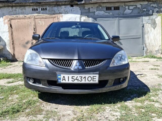 Сірий Міцубісі Lancer, об'ємом двигуна 1.6 л та пробігом 210 тис. км за 3603 $, фото 1 на Automoto.ua