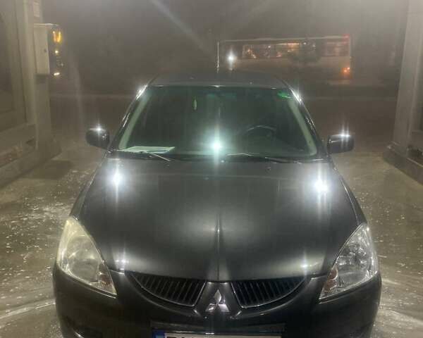 Серый Мицубиси Лансер, объемом двигателя 1.6 л и пробегом 324 тыс. км за 4200 $, фото 1 на Automoto.ua