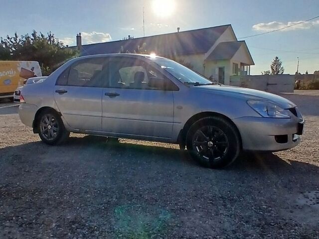 Сірий Міцубісі Lancer, об'ємом двигуна 1.6 л та пробігом 298 тис. км за 2800 $, фото 1 на Automoto.ua