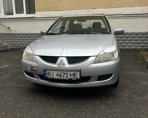 Сірий Міцубісі Lancer, об'ємом двигуна 1.6 л та пробігом 171 тис. км за 4500 $, фото 1 на Automoto.ua