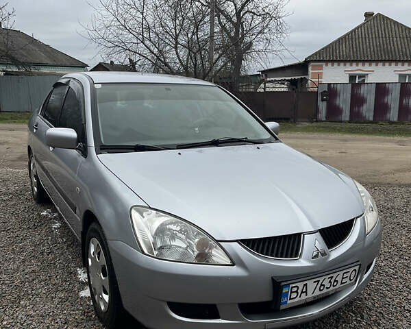 Сірий Міцубісі Lancer, об'ємом двигуна 1.58 л та пробігом 213 тис. км за 4300 $, фото 1 на Automoto.ua