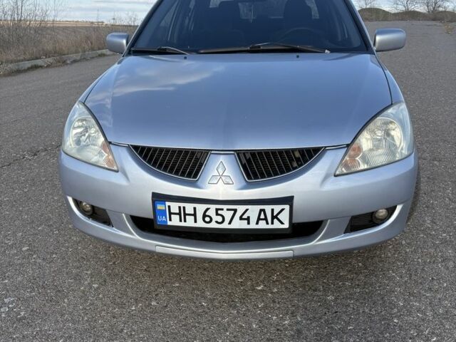Серый Мицубиси Лансер, объемом двигателя 1.6 л и пробегом 260 тыс. км за 4100 $, фото 1 на Automoto.ua
