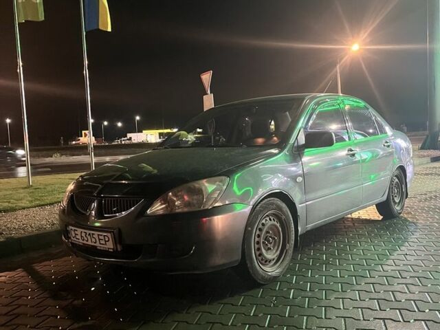 Серый Мицубиси Лансер, объемом двигателя 1.6 л и пробегом 269 тыс. км за 2999 $, фото 1 на Automoto.ua