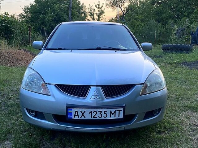 Сірий Міцубісі Lancer, об'ємом двигуна 1.6 л та пробігом 390 тис. км за 4400 $, фото 1 на Automoto.ua