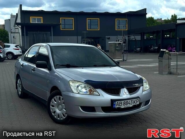Сірий Міцубісі Lancer, об'ємом двигуна 1.6 л та пробігом 300 тис. км за 3199 $, фото 1 на Automoto.ua