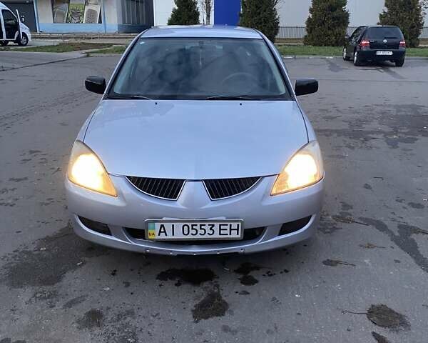 Мицубиси Лансер 2003 в Белой Церкве на Automoto.ua Серый Мицубиси Лансер, объемом двигателя 1.58 л и пробегом 350 тыс. км за 3300 $, фото 1 на Automoto.ua