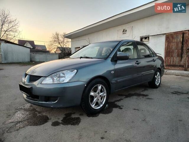 Сірий Міцубісі Lancer, об'ємом двигуна 1.58 л та пробігом 300 тис. км за 4200 $, фото 1 на Automoto.ua