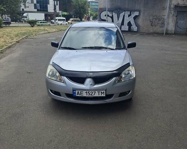 Сірий Міцубісі Lancer, об'ємом двигуна 1.58 л та пробігом 222 тис. км за 4000 $, фото 1 на Automoto.ua