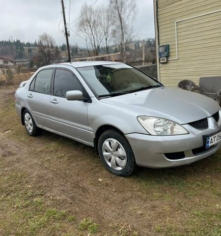 Серый Мицубиси Лансер, объемом двигателя 1.59 л и пробегом 176 тыс. км за 2800 $, фото 1 на Automoto.ua