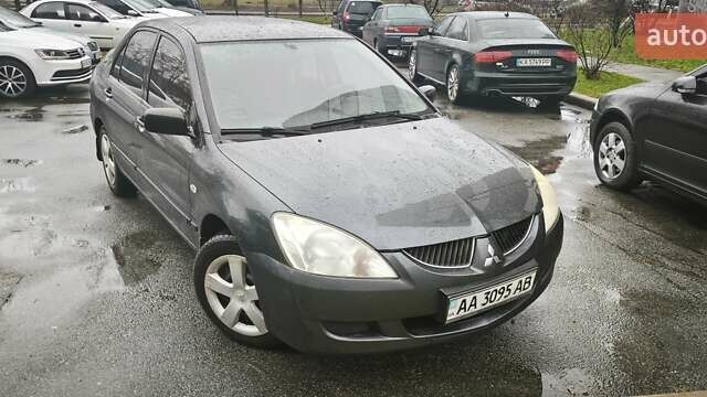 Сірий Міцубісі Lancer, об'ємом двигуна 1.58 л та пробігом 110 тис. км за 2999 $, фото 1 на Automoto.ua