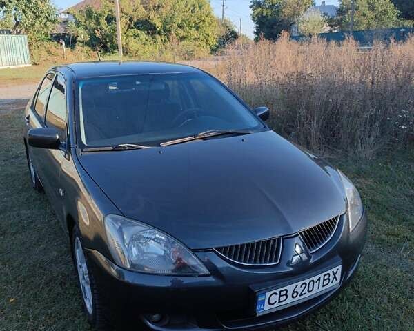 Мицубиси Лансер 2004 в Нежине на Automoto.ua Серый Мицубиси Лансер, объемом двигателя 2 л и пробегом 280 тыс. км за 6000 $, фото 1 на Automoto.ua