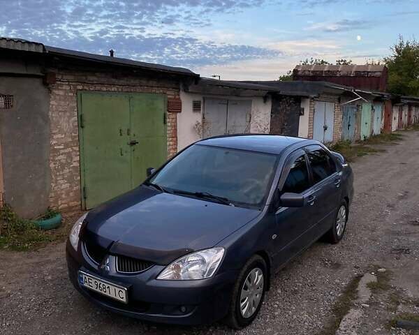 Сірий Міцубісі Lancer, об'ємом двигуна 1.58 л та пробігом 307 тис. км за 3800 $, фото 1 на Automoto.ua