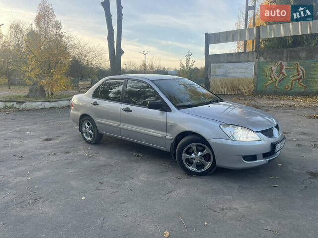 Сірий Міцубісі Lancer, об'ємом двигуна 1.58 л та пробігом 271 тис. км за 3000 $, фото 1 на Automoto.ua