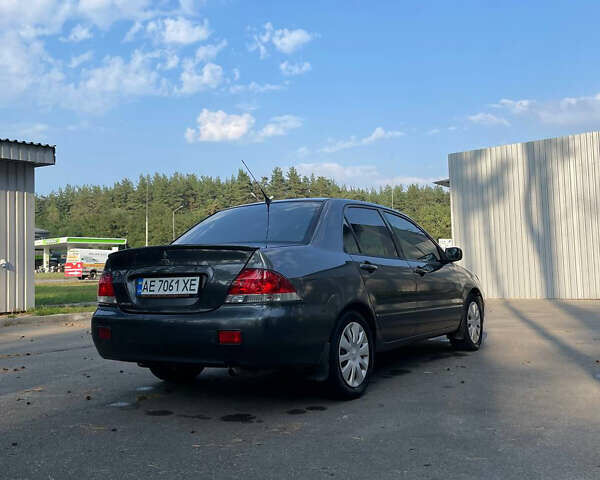 Сірий Міцубісі Lancer, об'ємом двигуна 1.6 л та пробігом 320 тис. км за 5400 $, фото 1 на Automoto.ua