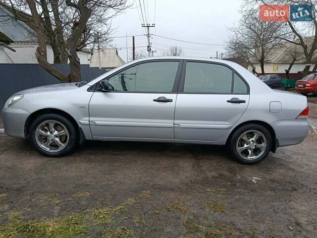 Сірий Міцубісі Lancer, об'ємом двигуна 1.58 л та пробігом 280 тис. км за 4000 $, фото 1 на Automoto.ua