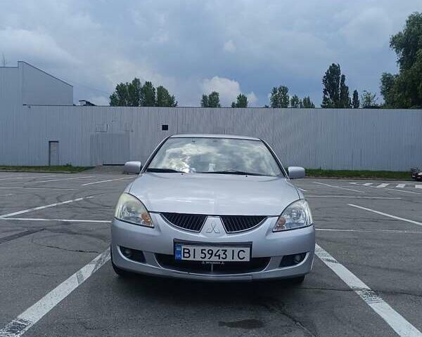Сірий Міцубісі Lancer, об'ємом двигуна 1.6 л та пробігом 242 тис. км за 4300 $, фото 1 на Automoto.ua