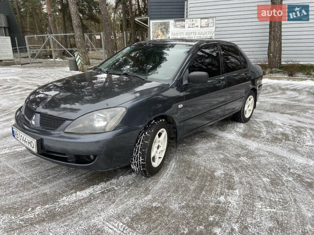 Серый Мицубиси Лансер, объемом двигателя 1.58 л и пробегом 265 тыс. км за 3499 $, фото 1 на Automoto.ua