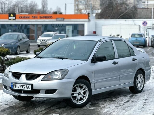 Серый Мицубиси Лансер, объемом двигателя 1.3 л и пробегом 289 тыс. км за 3399 $, фото 1 на Automoto.ua