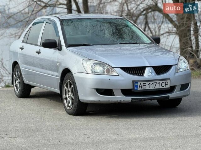 Сірий Міцубісі Lancer, об'ємом двигуна 1.3 л та пробігом 299 тис. км за 4200 $, фото 1 на Automoto.ua