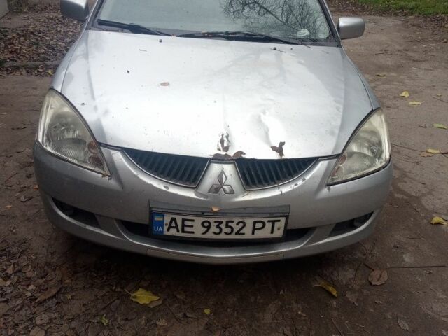 Серый Мицубиси Лансер, объемом двигателя 1.6 л и пробегом 320 тыс. км за 2851 $, фото 1 на Automoto.ua