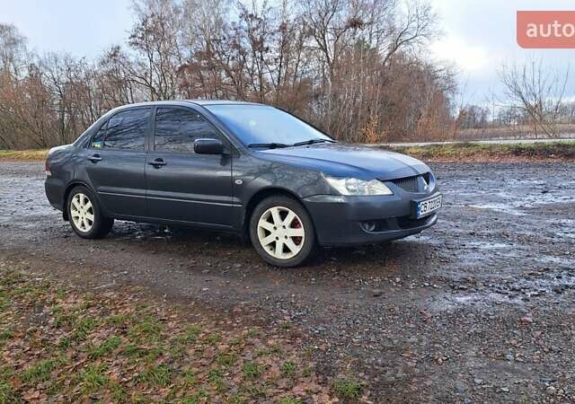 Мицубиси Лансер 2004 в Чернигове на Automoto.ua Серый Мицубиси Лансер, объемом двигателя 1.58 л и пробегом 320 тыс. км за 3900 $, фото 1 на Automoto.ua