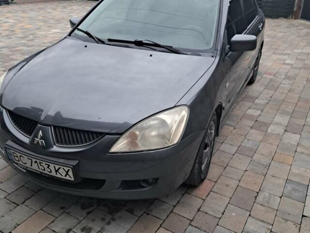 Сірий Міцубісі Lancer, об'ємом двигуна 1.58 л та пробігом 290 тис. км за 3900 $, фото 1 на Automoto.ua
