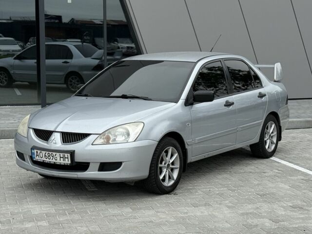 Серый Мицубиси Лансер, объемом двигателя 1.6 л и пробегом 360 тыс. км за 2400 $, фото 1 на Automoto.ua