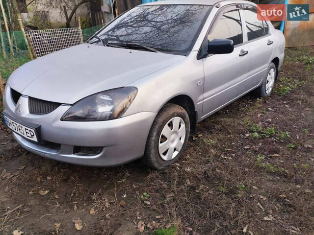 Серый Мицубиси Лансер, объемом двигателя 1.3 л и пробегом 450 тыс. км за 3500 $, фото 1 на Automoto.ua
