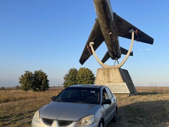 Сірий Міцубісі Lancer, об'ємом двигуна 1.6 л та пробігом 340 тис. км за 1564 $, фото 1 на Automoto.ua