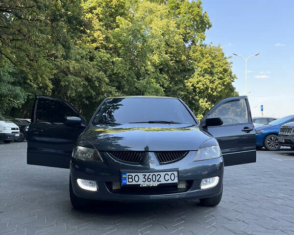 Сірий Міцубісі Lancer, об'ємом двигуна 1.58 л та пробігом 300 тис. км за 3800 $, фото 1 на Automoto.ua