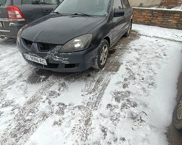 Серый Мицубиси Лансер, объемом двигателя 1.58 л и пробегом 300 тыс. км за 2550 $, фото 1 на Automoto.ua