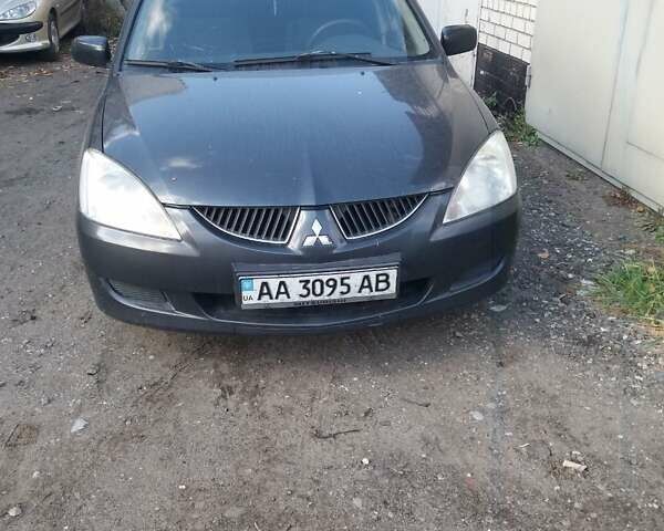 Сірий Міцубісі Lancer, об'ємом двигуна 1.58 л та пробігом 531 тис. км за 2828 $, фото 1 на Automoto.ua