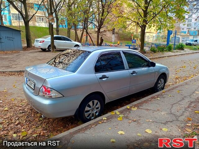 Сірий Міцубісі Lancer, об'ємом двигуна 1.3 л та пробігом 230 тис. км за 4000 $, фото 1 на Automoto.ua