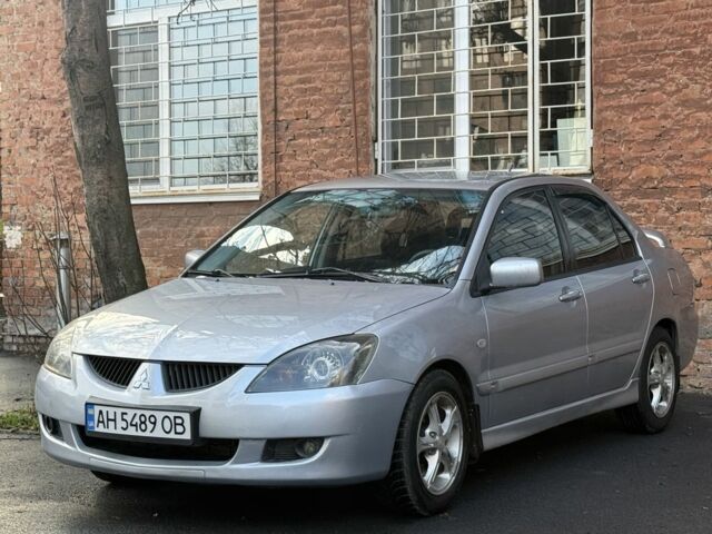 Серый Мицубиси Лансер, объемом двигателя 2 л и пробегом 180 тыс. км за 3700 $, фото 1 на Automoto.ua