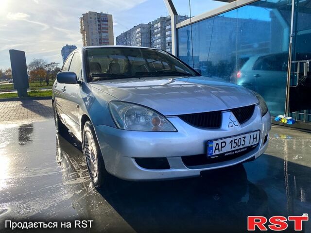 Серый Мицубиси Лансер, объемом двигателя 1.3 л и пробегом 376 тыс. км за 3700 $, фото 1 на Automoto.ua