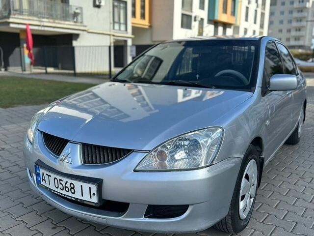 Сірий Міцубісі Lancer, об'ємом двигуна 1.59 л та пробігом 200 тис. км за 1899 $, фото 1 на Automoto.ua