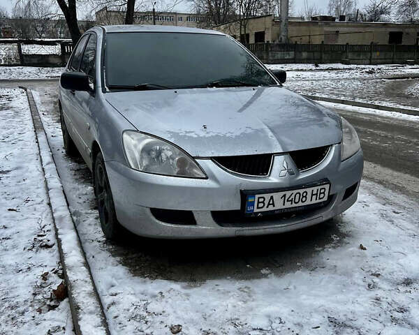 Серый Мицубиси Лансер, объемом двигателя 1.58 л и пробегом 340 тыс. км за 3100 $, фото 1 на Automoto.ua