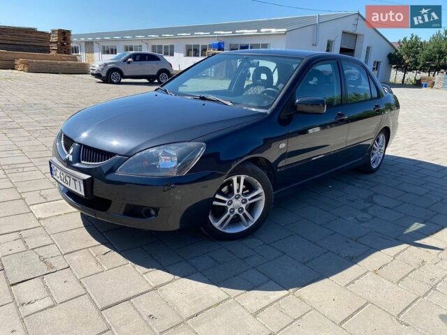 Сірий Міцубісі Lancer, об'ємом двигуна 2 л та пробігом 306 тис. км за 4000 $, фото 1 на Automoto.ua
