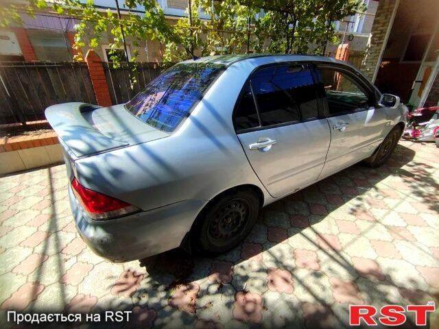 Сірий Міцубісі Lancer, об'ємом двигуна 1.6 л та пробігом 308 тис. км за 3500 $, фото 1 на Automoto.ua