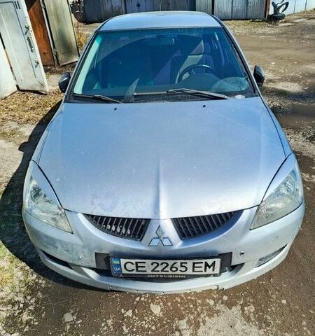 Серый Мицубиси Лансер, объемом двигателя 1.58 л и пробегом 445 тыс. км за 2900 $, фото 1 на Automoto.ua