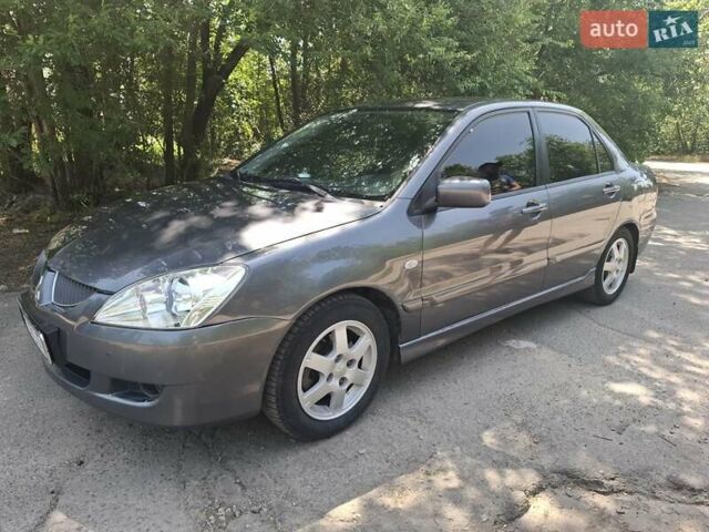 Сірий Міцубісі Lancer, об'ємом двигуна 1.58 л та пробігом 200 тис. км за 3800 $, фото 1 на Automoto.ua
